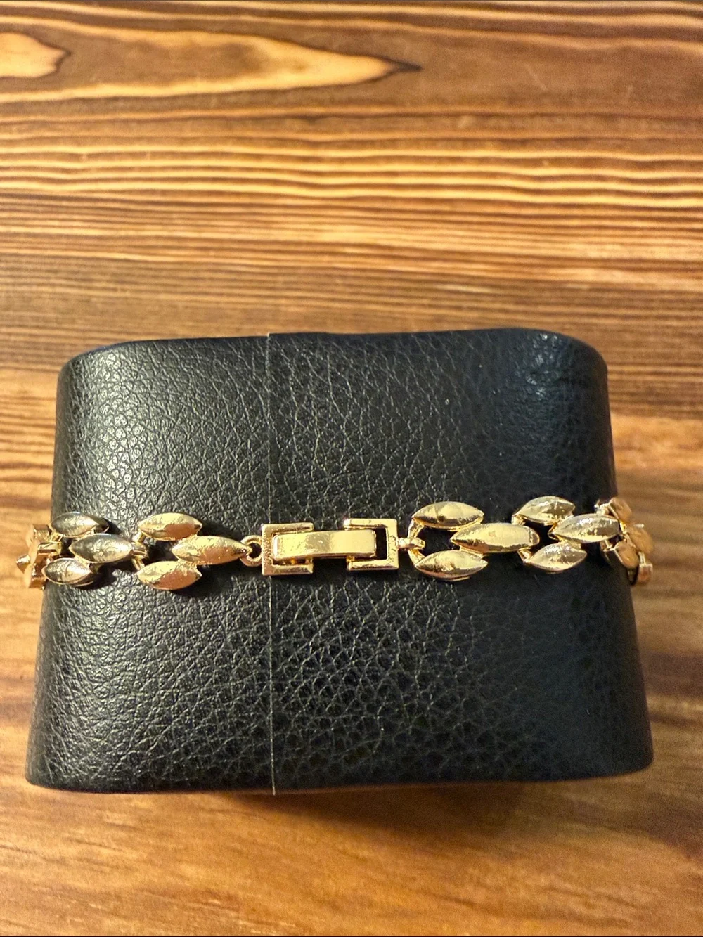 Gold-Tone Bracelet with Red Gem Leaf Accents